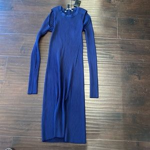 BCBG mid length body on dress with slit and cut outs in the shoulder.